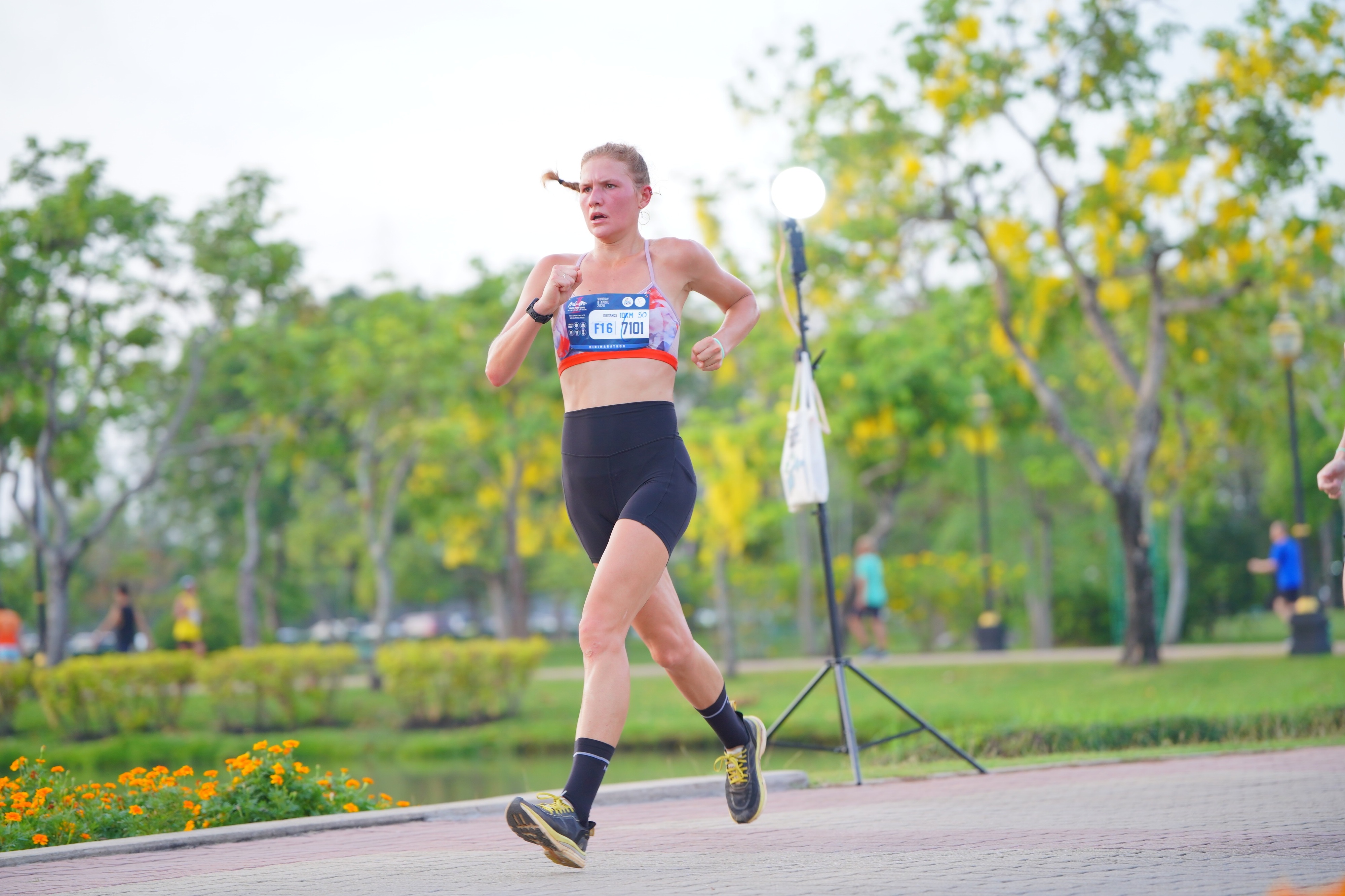 Kiana racing in a tropical setting
